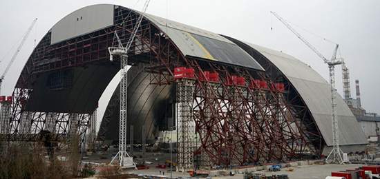 Chernobyl New Safe Confinement under construction and before being moved into place