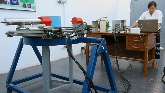 researcher prepares equipment to be used in non destructive testing