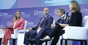Four speakers in a panel session at an IAEA conference